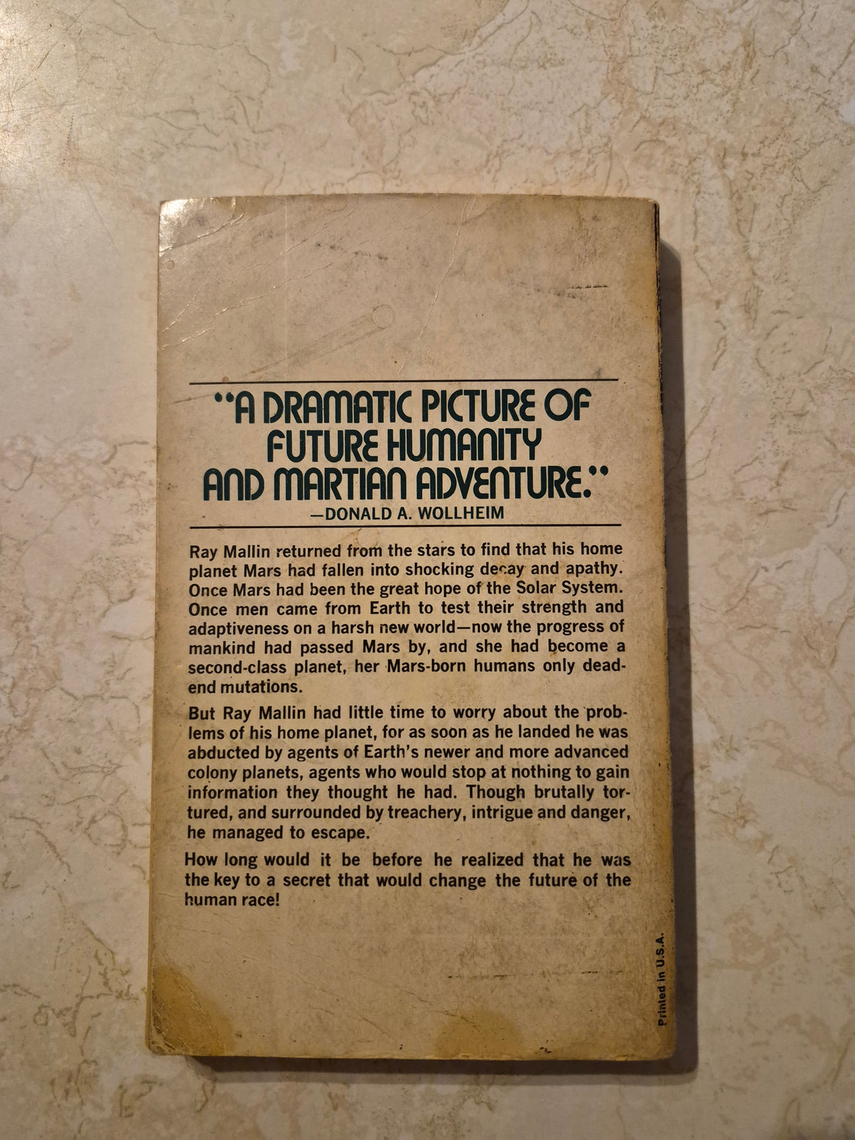 Back cover of Born Under Mars by John Brunner showing age marks