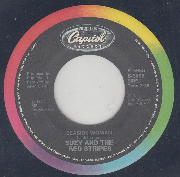 Suzy And The Red Stripes : Seaside Woman (7", Single, RE)