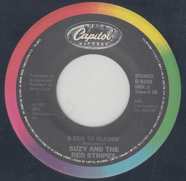 Suzy And The Red Stripes : Seaside Woman (7", Single, RE)
