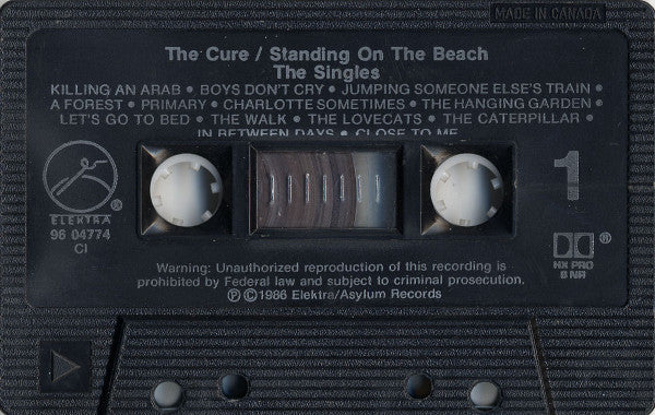The Cure : Standing On A Beach • The Singles (And Unavailable B-Sides) (Cass, Comp, M/Print, RP, Dol)