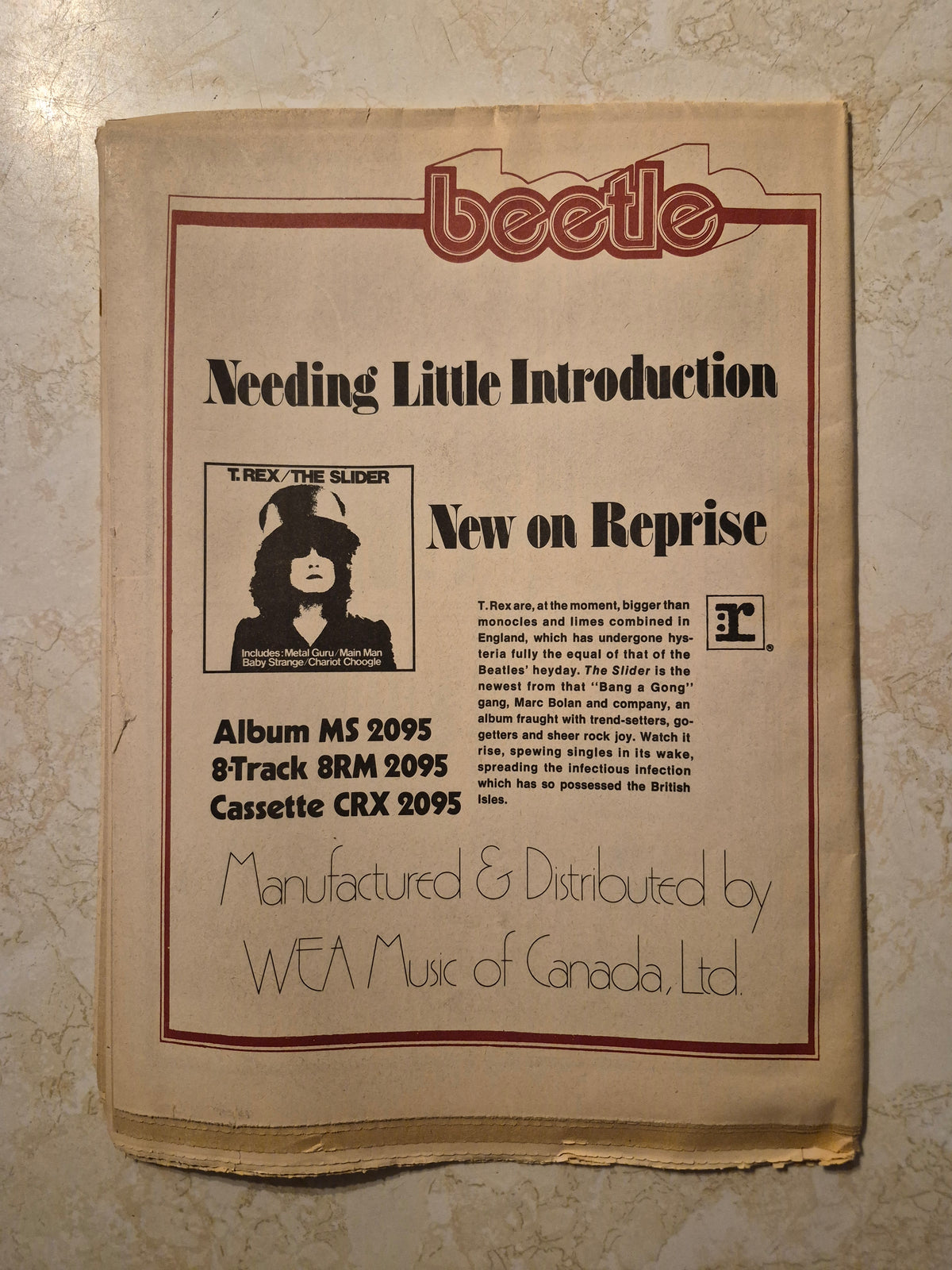 Beetle back cover with Canadian Reprise advertisement for T. Rex The Slider