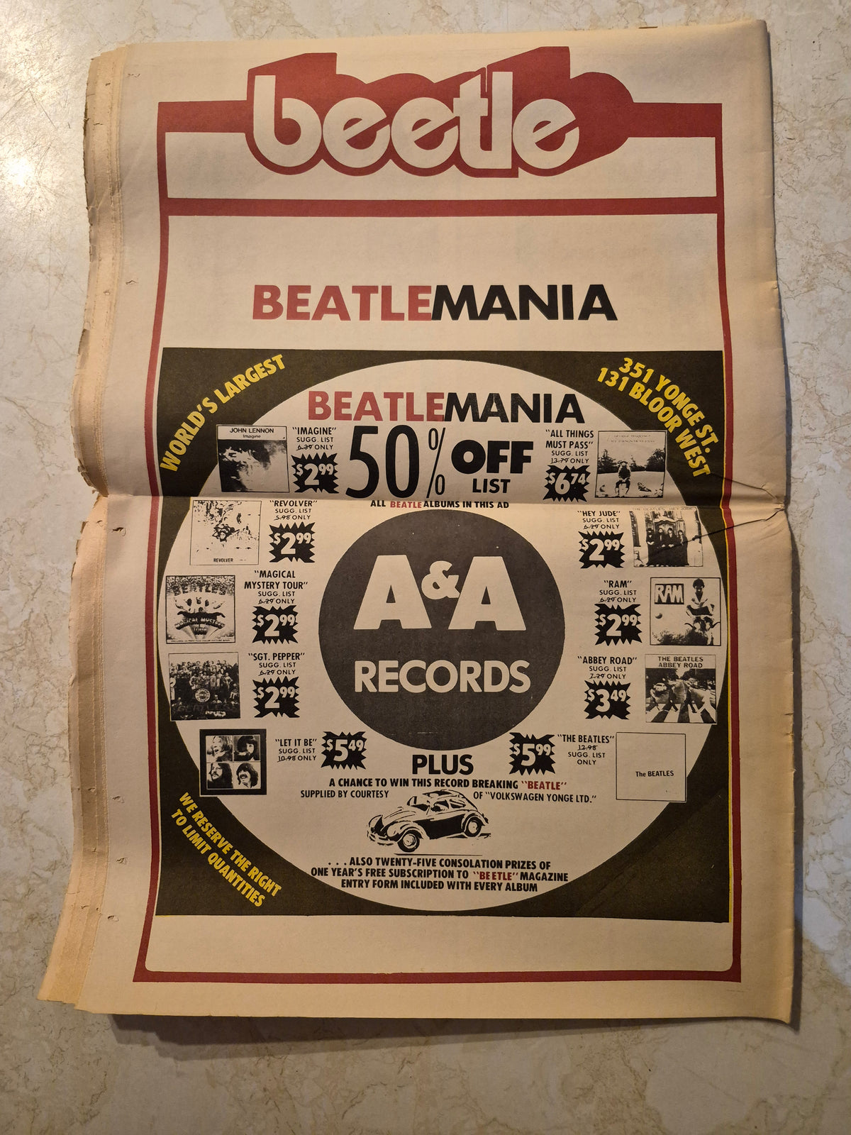 Beetle interior spread with A&A Records Beatlemania advertisement and horizontal fold