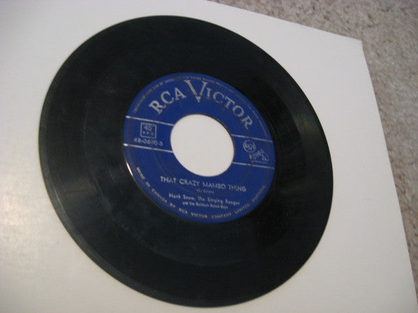 Hank Snow, The Singing Ranger* And The Rainbow Ranch Boys : The Next Voice You Hear / That Crazy Mambo Thing (7", Single)
