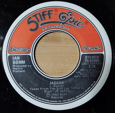 Ian Gomm : Here It Comes Again (That Feeling) / Jaguar (7", Single)