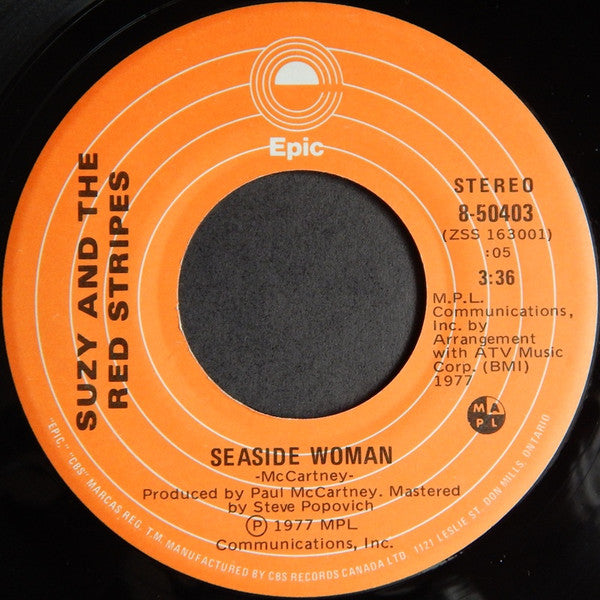 Suzy And The Red Stripes : Seaside Woman (7", Single)