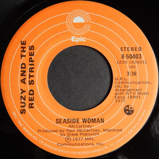 Suzy And The Red Stripes : Seaside Woman (7", Single)