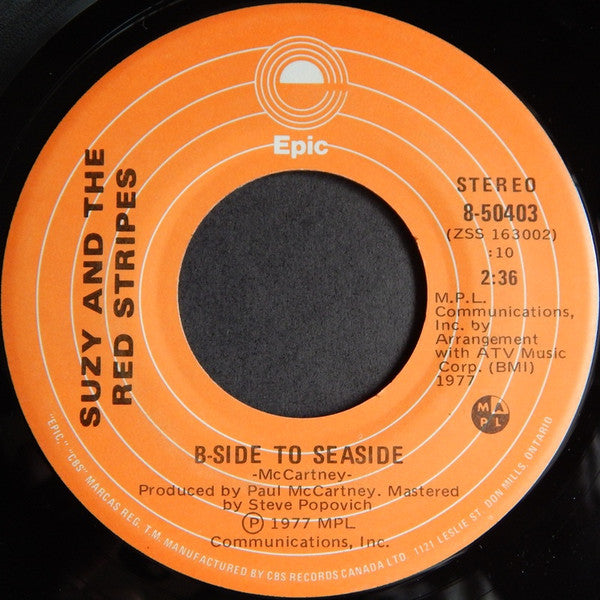 Suzy And The Red Stripes : Seaside Woman (7", Single)