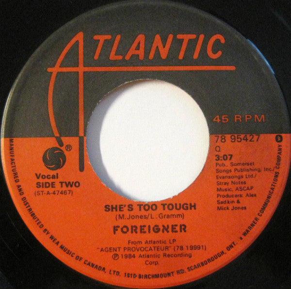 Foreigner : Reaction To Action / She's Too Tough (7", Single)