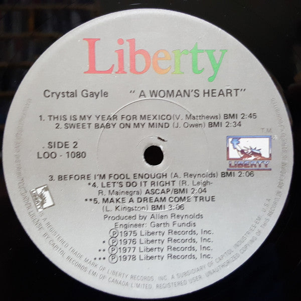 Crystal Gayle : A Woman's Heart (LP, Comp)
