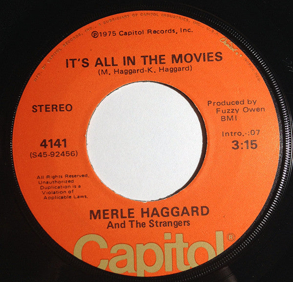 Merle Haggard And The Strangers (5) : It's All In The Movies / Living With The Shades Pulled Down (7", Single)