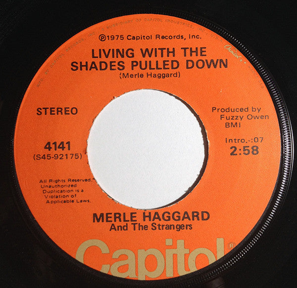 Merle Haggard And The Strangers (5) : It's All In The Movies / Living With The Shades Pulled Down (7", Single)
